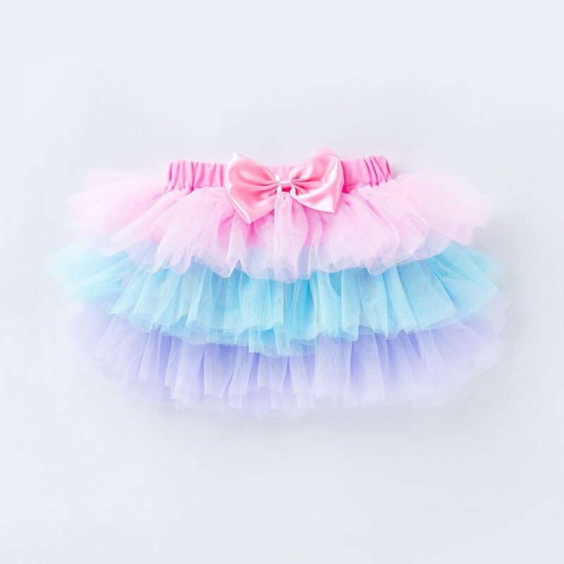 Baby girl pastel rainbow tutu skirt with layered tulle and pink bow for first birthday outfit