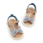 Top view of baby girls striped bow sandals with braided strap and open toe design