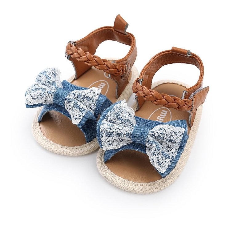 Pair of baby girls denim blue lace bow sandals with braided ankle straps