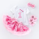 Baby girl first birthday outfit with number one bodysuit pale pink polka dot tutu skirt headband and shoes