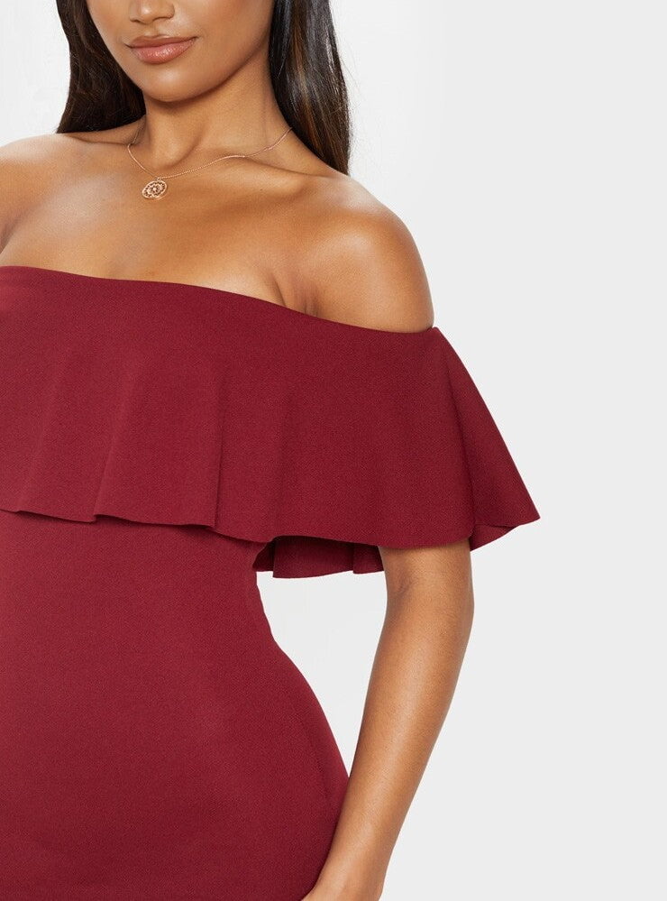 front view of burgundy bardot midi dress with off shoulder frill neckline fitted style and side split hem