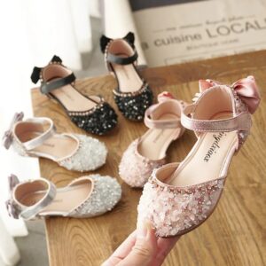 Girls crystal embellished party shoes available in pink, black and silver with ankle strap and bow detail