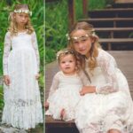 Girls Long Sleeve Lace Flower Girl Dress - ivory (9) Two girls wearing ivory lace flower girl dresses with long sleeves sitting together with floral headbands