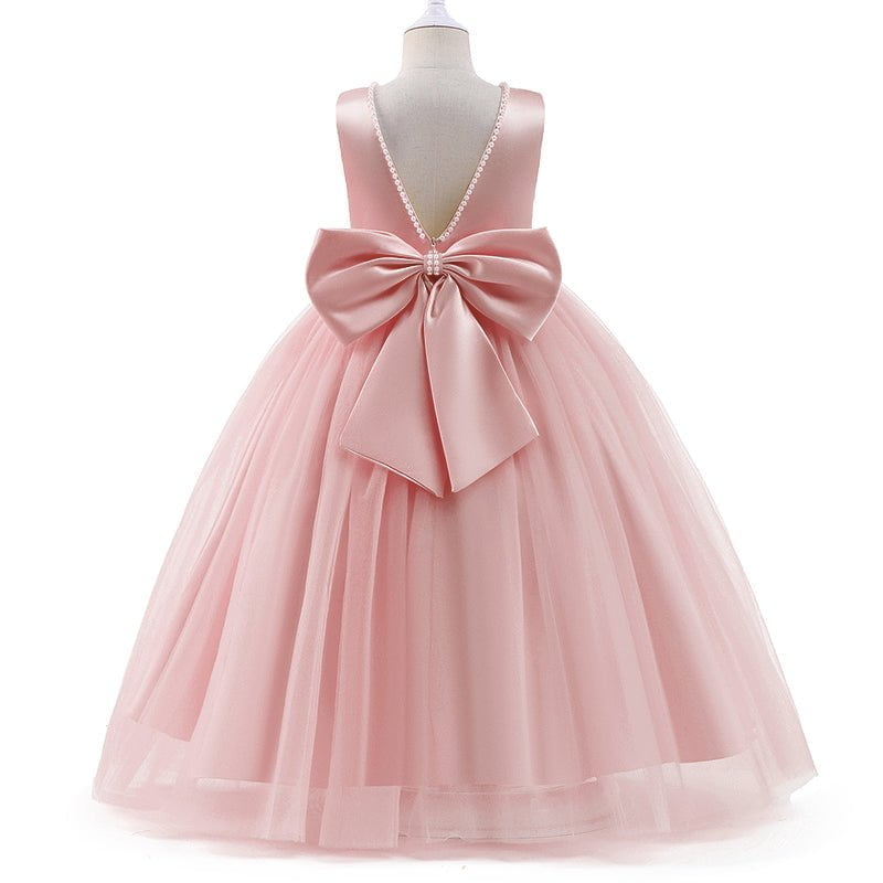 Pink flower girl dress with satin bodice, pearl neckline and voluminous tulle skirt