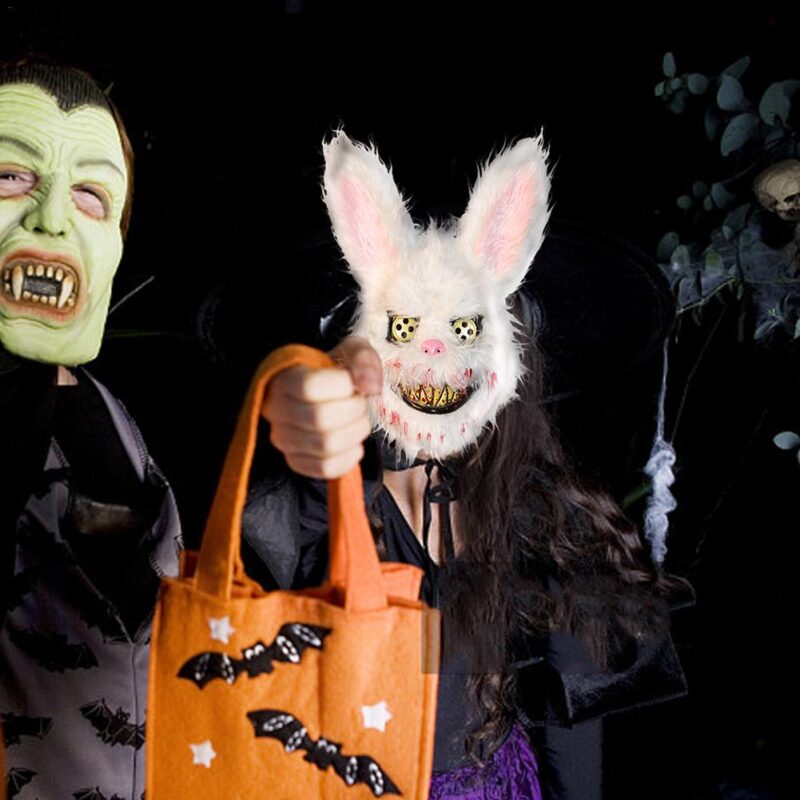 Person wearing a horror rabbit mask while trick or treating during a Halloween celebration