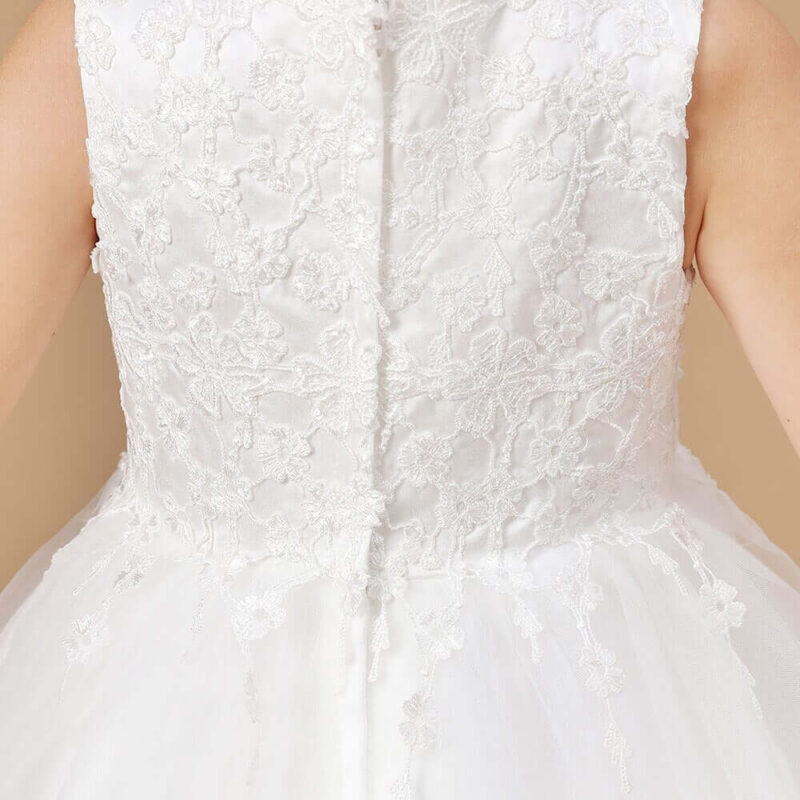 Close up back view of ivory flower girl dress with lace bodice and button fastening detail