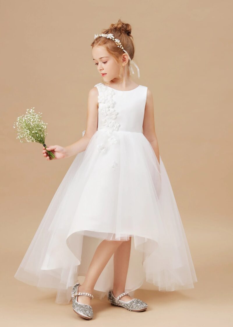 Girls white flower girl dress with high low hem holding bouquet, sleeveless formal wedding dress with soft tulle layers