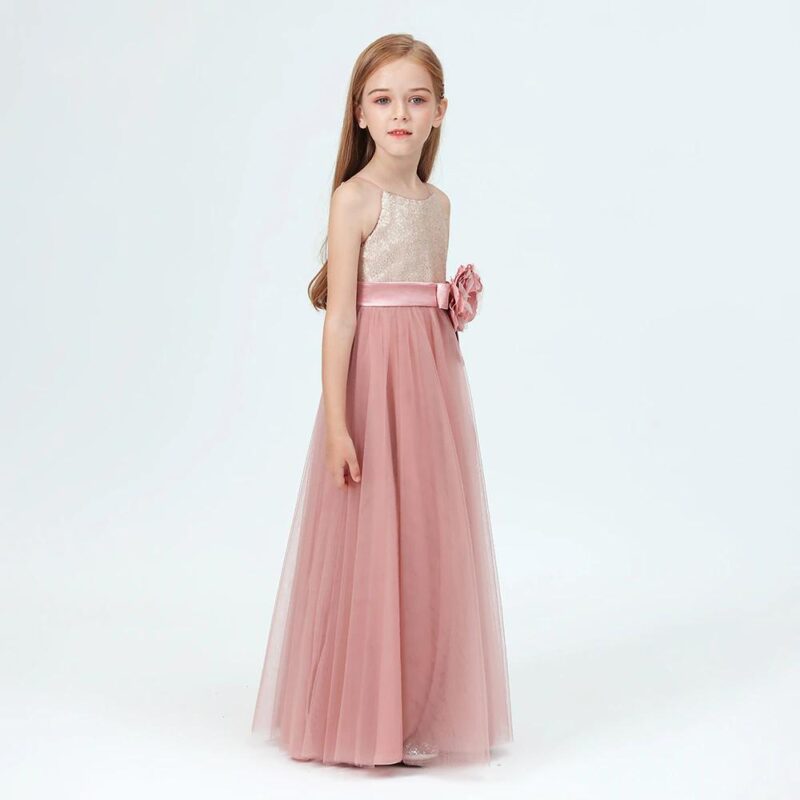 Elegant dusty pink junior bridesmaid gown with glitter sequin top and flowing tulle skirt for weddings and formal occasions.