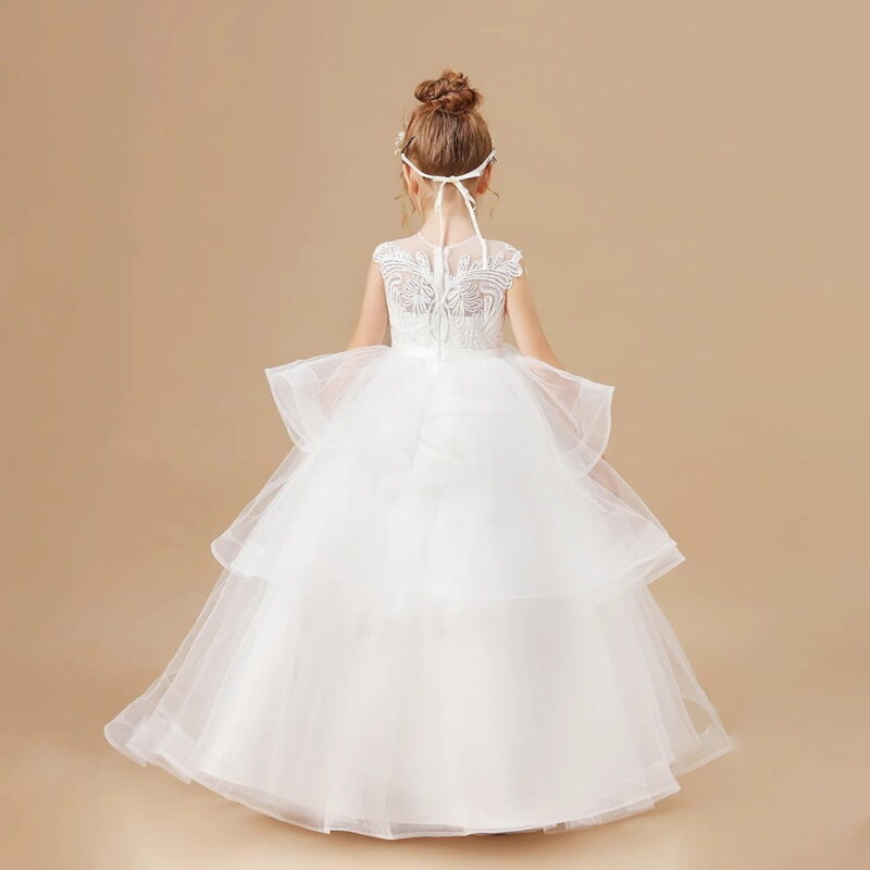 Back view of girls ivory flower girl dress with layered tulle skirt and embroidered lace bodice for weddings