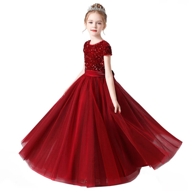 Elegant burgundy girls sequin princess gown with sparkling bodice, full tulle skirt and satin waistband for weddings and parties.