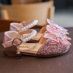 Pink girls glitter butterfly bow shoes with pearl strap and rhinestone detailing, stylish occasion footwear for kids