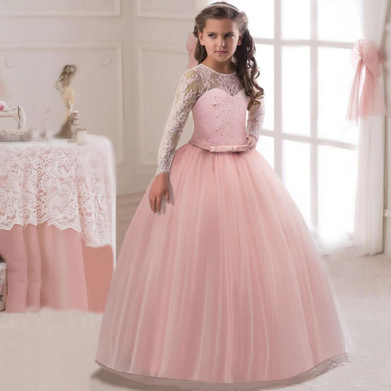 Pink long sleeve lace flower girl dress with tulle ball gown skirt and fitted waist detail