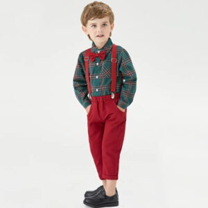 Toddler boy wearing green tartan Christmas outfit with burgundy trousers, braces and bow tie