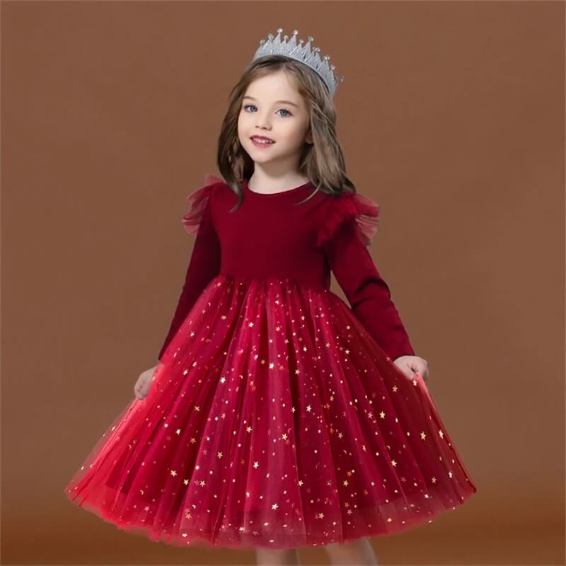 Girl wearing red velvet star tulle Christmas party dress with long sleeves