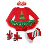 Baby girl Christmas outfit flat lay with mismatched leg warmers and ribbon tie shoes