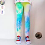 Aurora Wash Fleece Leggings for Girls Girl wearing colourful aurora wash fleece leggings with a pastel blue, green, yellow and pink print and warm fleece lining.