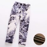 Black and white flower print winter leggings for girls with all-over rose design and soft warm fleece lining