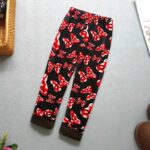 Black bow print fleece leggings for girls with red and white pattern, elasticated waist and warm brown lining