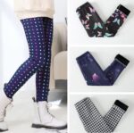Girls navy polka dot fleece leggings with colourful pink, green and white dots styled with white boots