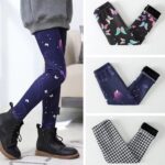 Girls navy twilight butterfly fleece lined leggings with purple print styled with black ankle boots