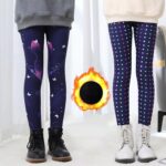Girls patterned fleece lined leggings shown in navy twilight butterfly and colourful polka dot designs