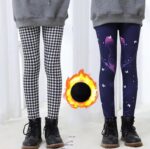 Girls winter fleece leggings shown in black and white houndstooth and navy twilight butterfly designs