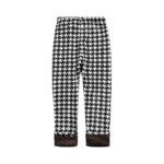 Black and white houndstooth print winter leggings for girls with warm brown fleece lined cuffs.