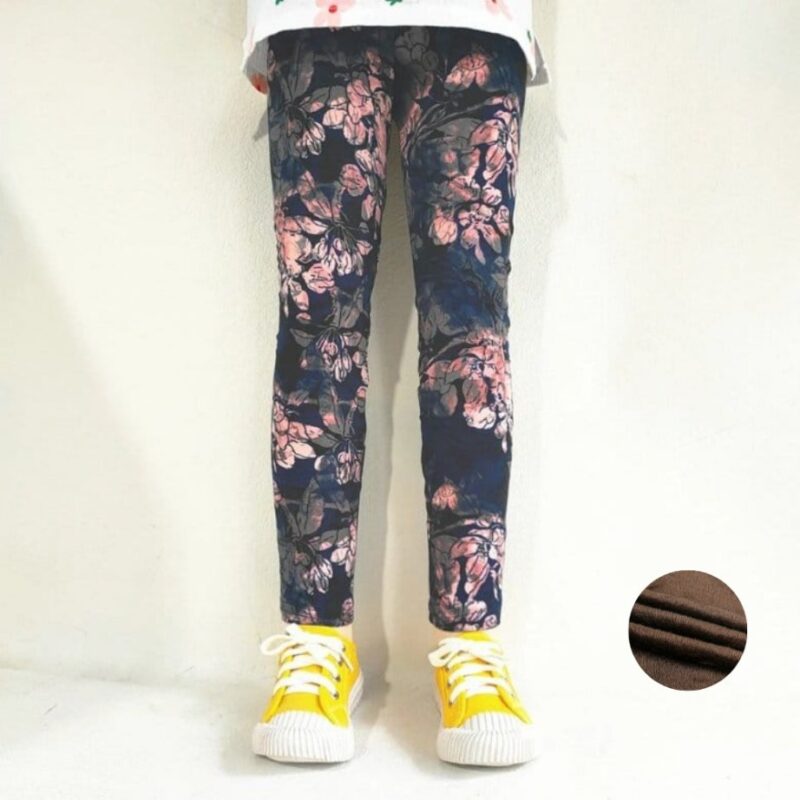 Girl wearing midnight blue floral fleece leggings with pink and grey flower print and warm fleece lining.