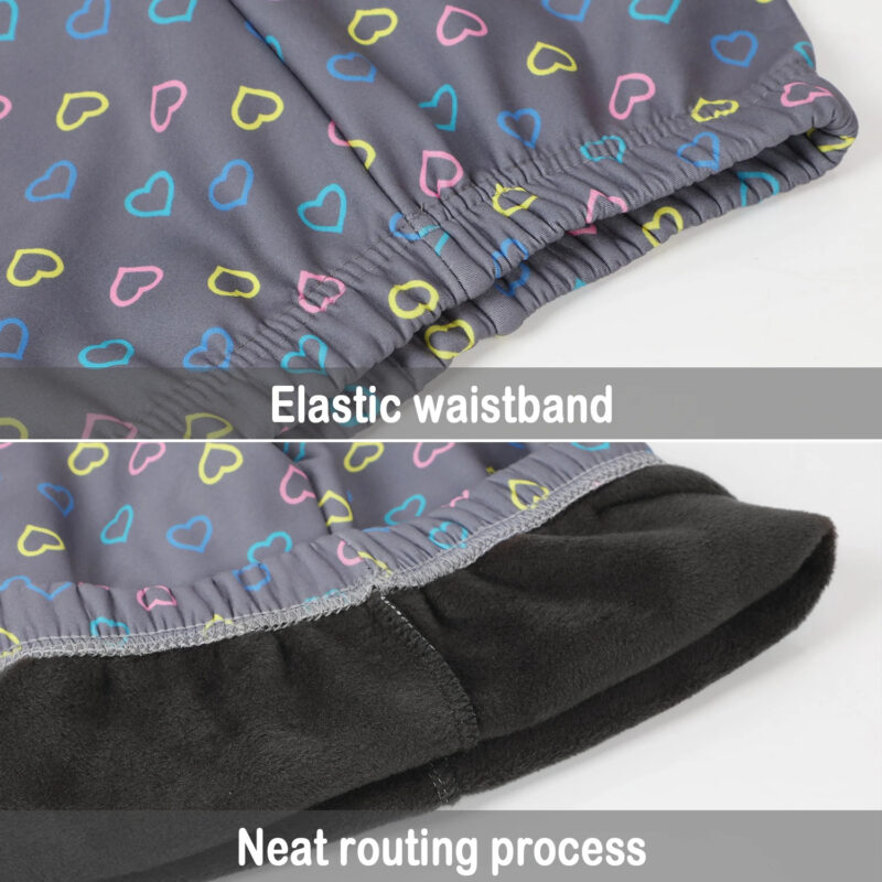Close-up of grey heart print winter leggings for kids showing the elasticated waistband and soft fleece lining.