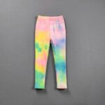 raunbow Aurora Wash Fleece Leggings for Girls (2) Girls rainbow aurora wash leggings with a pastel pink, yellow, green and blue print and slim fitted design.