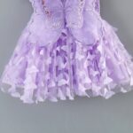 Enchanting Butterfly Fairy Dress with Attached Wings (2) Close-up of girls lilac fairy dress with sequin butterfly wings and layered butterfly appliqué tulle skirt