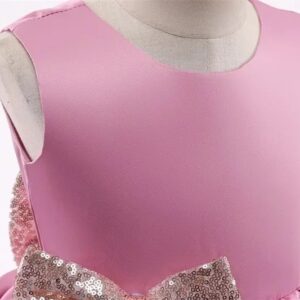 Close-up of sleeveless pink bodice and sequin bow detail on girls multi-layer princess party dress