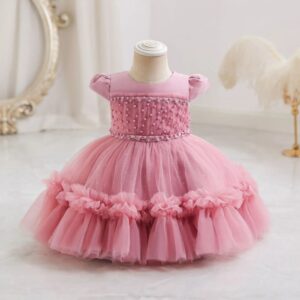 Dark pink ruffled tulle occasion dress for girls with pearl embellished bodice, puff sleeves and full layered skirt