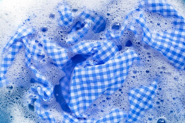 Seersucker Fabric: A Timeless Choice for Summer Clothing - Fabulous Bargains Galore seersucker fabric dipped in soapy water for washing