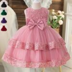 Sparkling Sequin Princess Ball Gown for Girls Pink sequin princess ball gown for girls with sleeveless bodice, large satin bow and layered tulle skirt