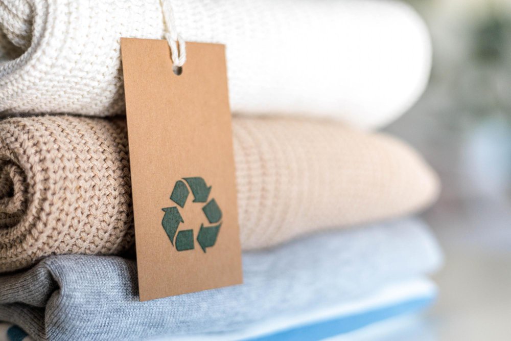 Cotton-Spandex Blend: The Ideal Fabric for Comfortable Performance Wear - Fabulous Bargains Galore Knitted warm clothes neatly folded heap with craft tag recycling material