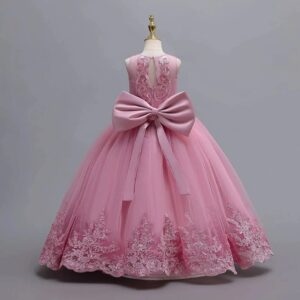 Back view of dusty pink girls lace and tulle ball gown with keyhole bodice, large satin bow and embroidered hem