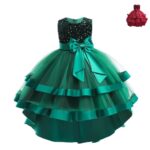 Green girls high low ball gown with black sequin bodice, layered tulle skirt, satin ribbon trim and large bow detail.
