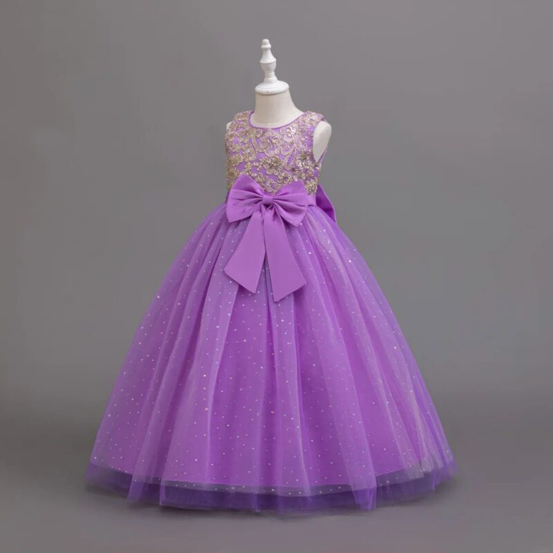 Side view of purple girls occasion ball gown with gold sequin bodice, satin bow and sparkling full tulle skirt
