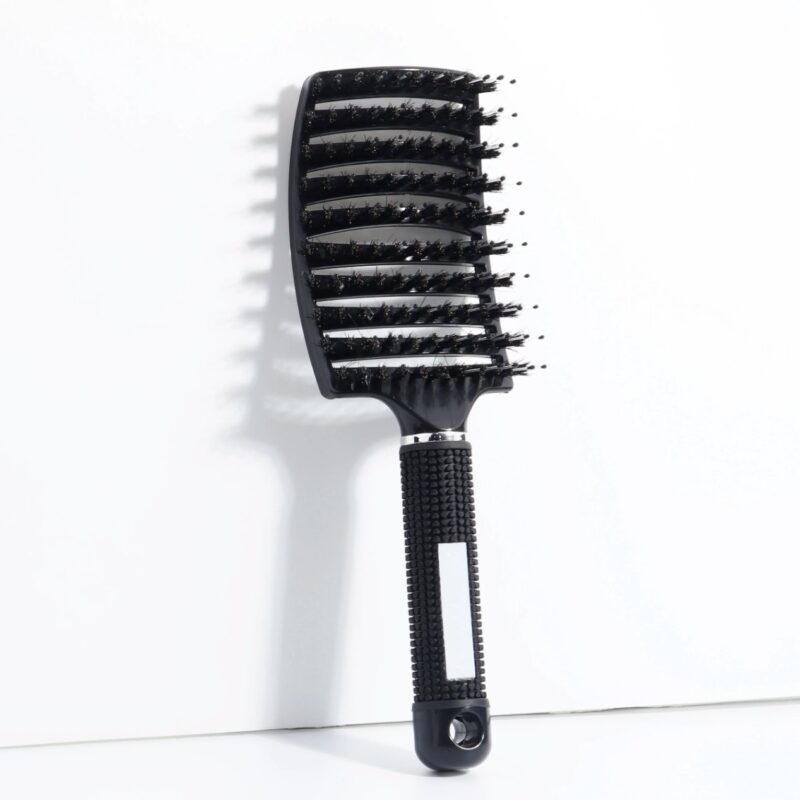 Black vented detangling brush for thick hair with flexible bristles and non slip handle