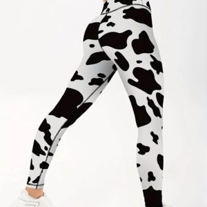 Women’s black and white cow print leggings side view