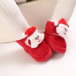 Baby Corduroy Santa Christmas Boots (7) Baby wearing corduroy Santa Christmas boots with plush fleece lining and festive Santa decoration