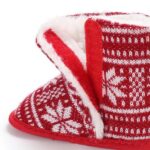 Close up of Baby Fair Isle Pom Pom Christmas booties showing soft faux fur lining and knitted cuff