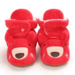 Front view of baby teddy bear Christmas boots with embroidered bear face and snap fastening