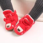Baby wearing red teddy bear Christmas boots with fleece lining and non slip sole