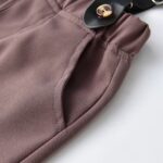 Close up of side pocket on boys brown formal trousers