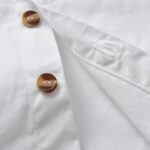Boys White Shirt and Tweed Trousers Outfit Set 4 Close up of boys white shirt button fastening and quality stitching