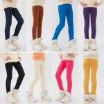 Girls warm fleece leggings shown in black, brown, blue, purple, cream, pink and yellow colour options