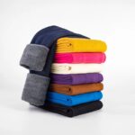 Folded classic fleece leggings for girls in assorted colours showing thick soft fleece lining
