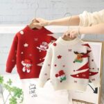 Red and cream kids Christmas jumpers with festive tree designs, snowflakes and colourful chenille character patches.